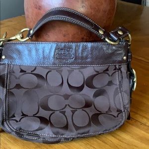 All brown medium sized coach purse